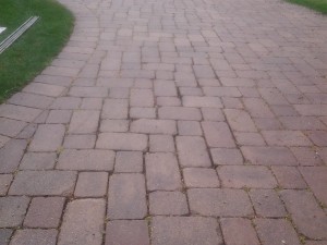 Poorly maintained brick driveway